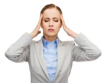 stressed-businesswoman-having-headache